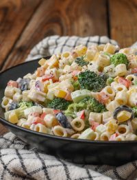 Creamy Macaroni Salad with Vegetables in black bowl