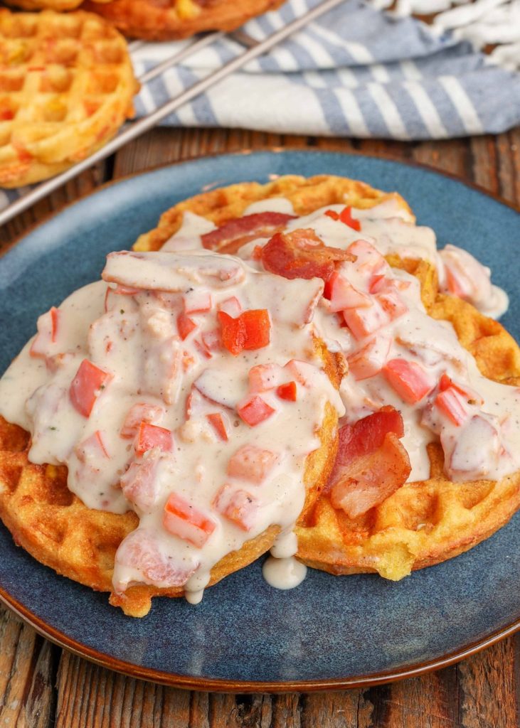 Red Pepper Bacon Gravy over corn waffles on plate