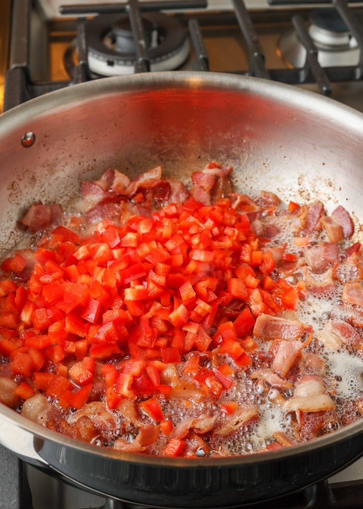 red pepper and bacon in skillet