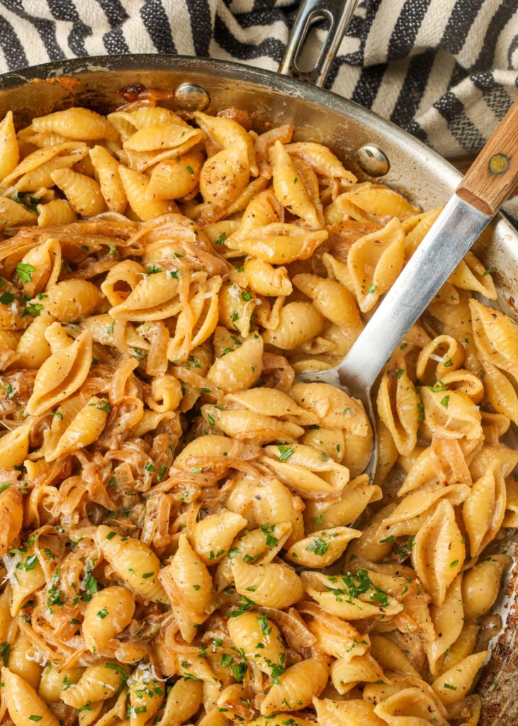 The pasta is almost ready to serve, having been assembled and is ready to finish with cheese and herbs.