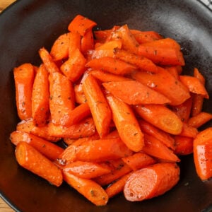 overhead shot of carrots in black bowl