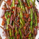 oval platter with sauteed asparagus and onion