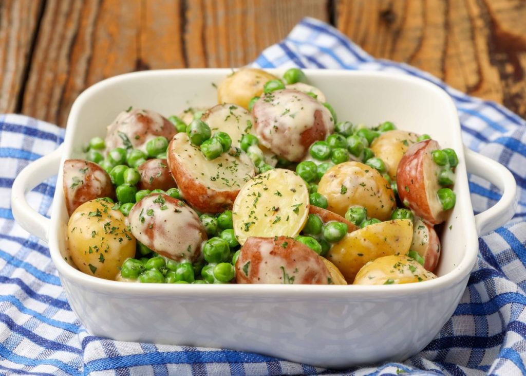 potatoes and peas in square white dish