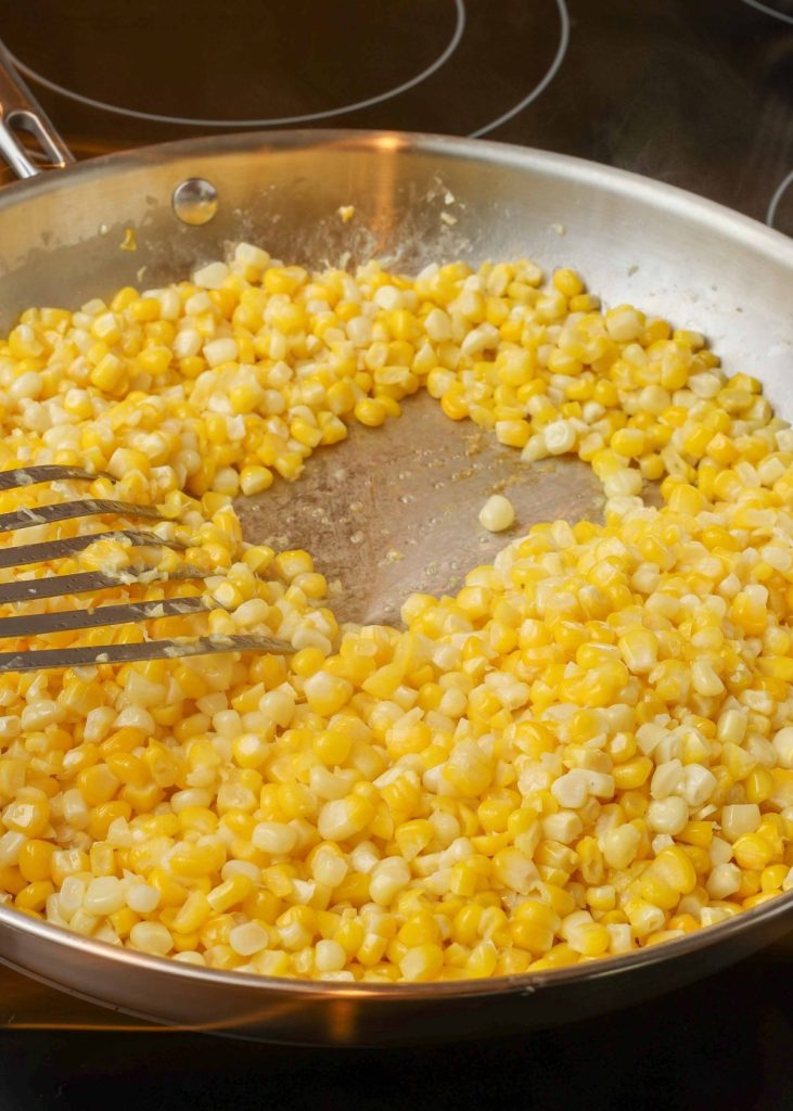 cook until all liquid has evaporated and corn starts sizzling against the pan
