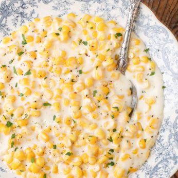 creamed corn in bowl with spoon