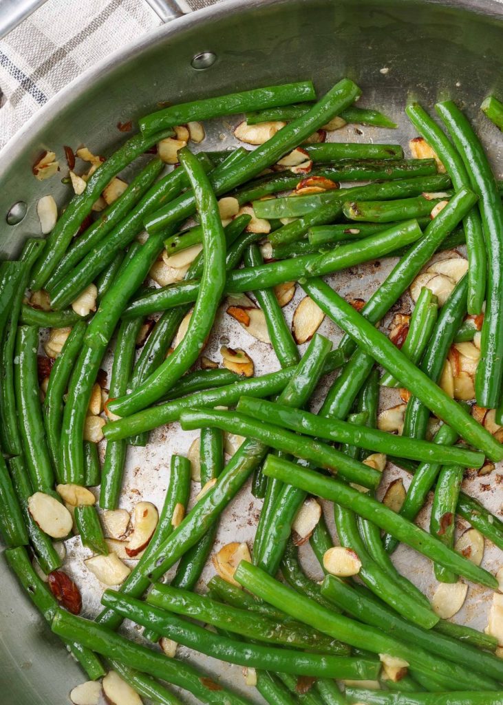 green beans in large skillet with plaid napkin