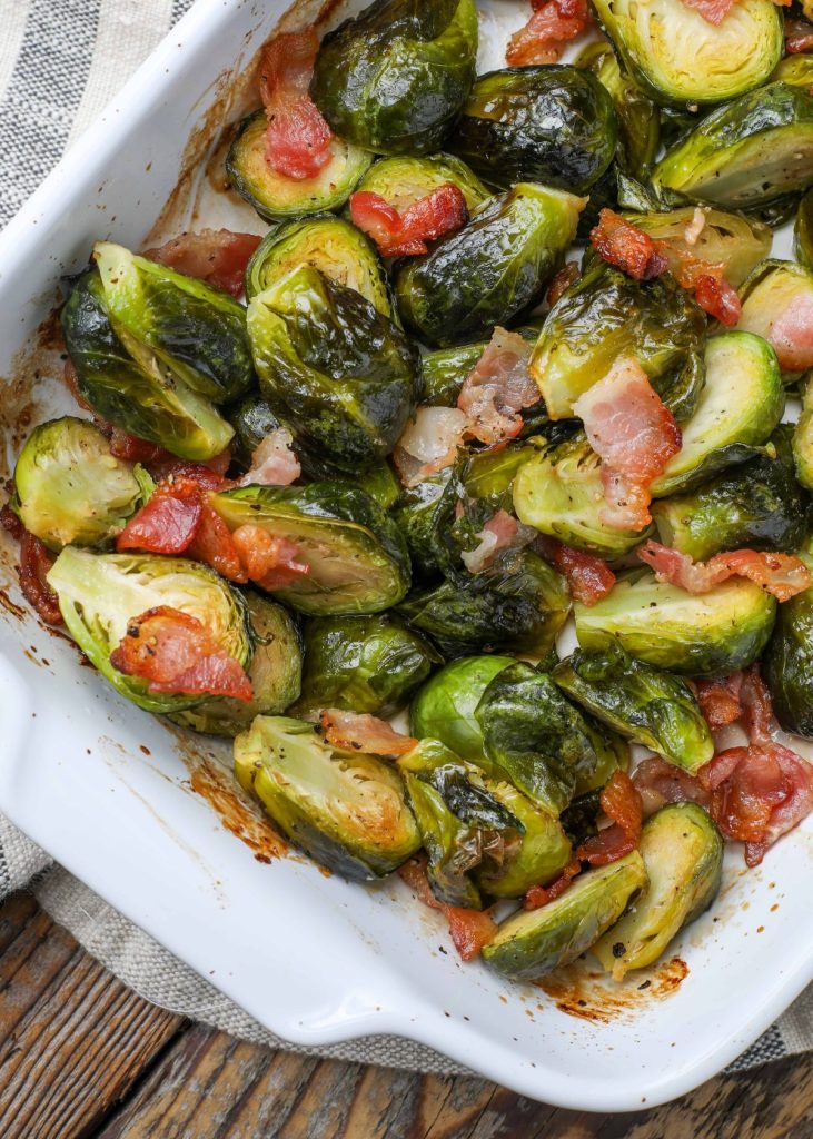 Brussels with bacon in white baking dish