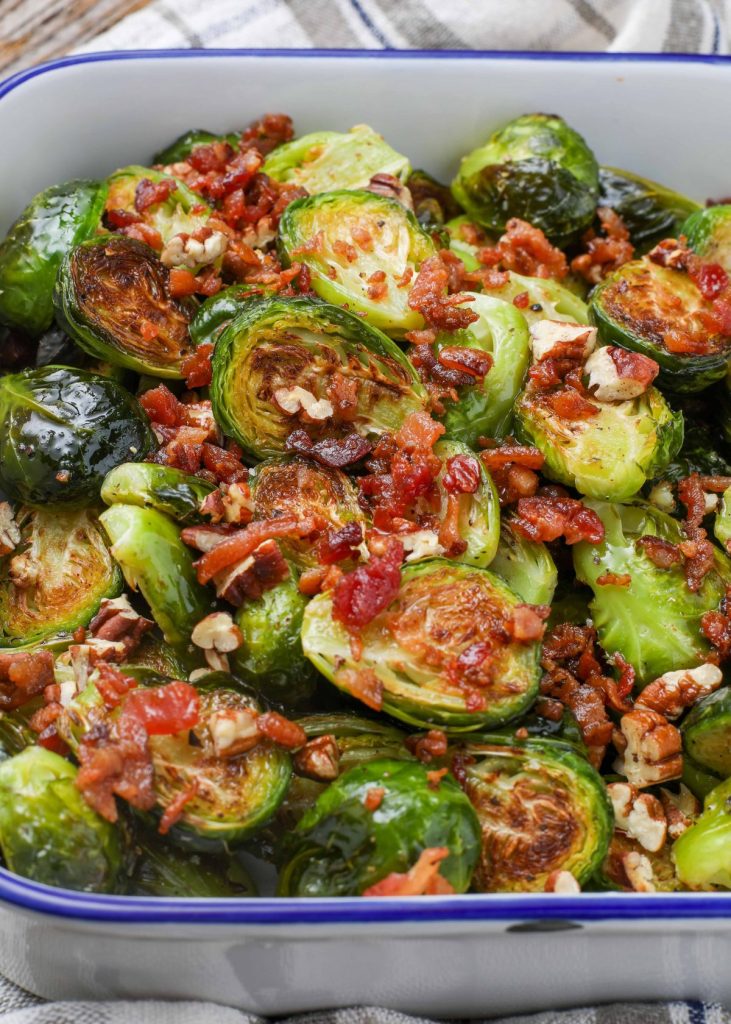 blue edged pan holding roasted Brussels