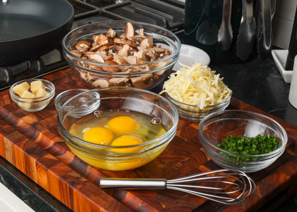 ingredients on cutting board next to stove