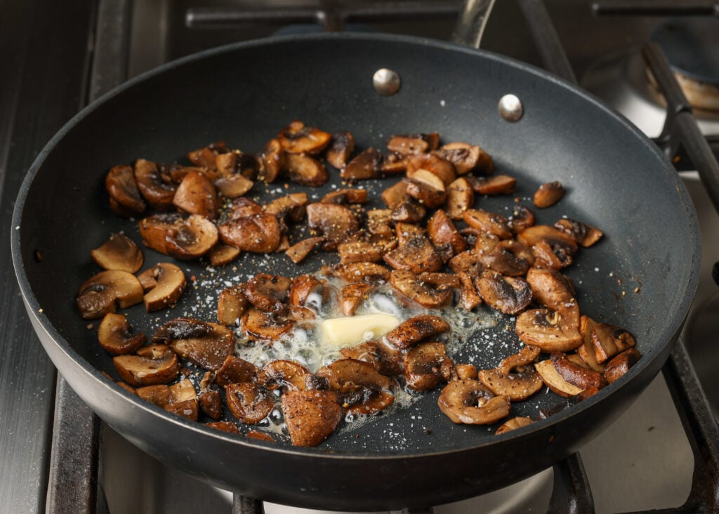 sauteed mushrooms with butter and garlic on skillet