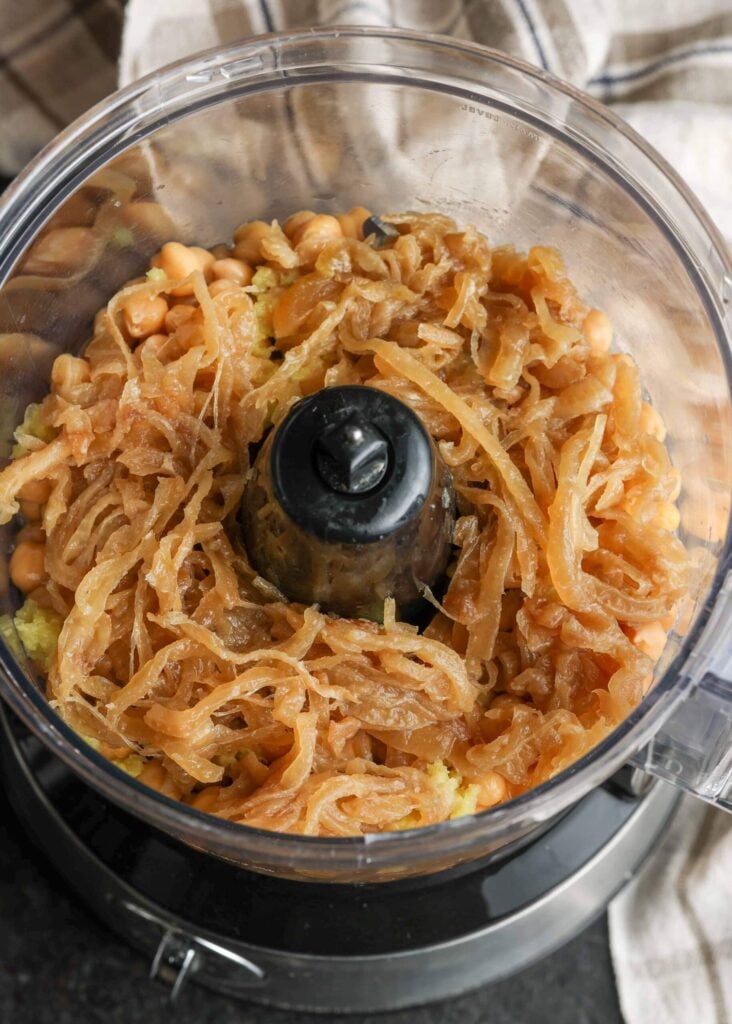 adding onions to food processor
